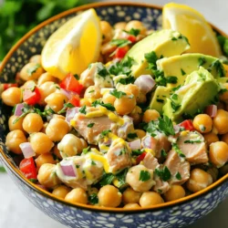To make a tasty chickpea tuna salad, gather these simple ingredients: - 1 can (15 oz) chickpeas, drained and rinsed - 1 can (5 oz) tuna in water, drained - 1/4 cup Greek yogurt (or vegan mayo) - 1 tablespoon Dijon mustard - 1/2 red bell pepper, finely chopped - 1/4 red onion, finely chopped - 1/4 cup fresh parsley, chopped - 1 tablespoon lemon juice - Salt and black pepper to taste - Optional: 1 avocado, diced Each item plays a role. Chickpeas give protein and fiber. Tuna adds more protein and depth. Greek yogurt or vegan mayo keeps it creamy. Dijon mustard gives a zesty kick. The red bell pepper and onion add crunch and sweetness. Fresh parsley brings a burst of color and flavor. Lemon juice brightens the dish. Season to your taste with salt and pepper. If you want extra creaminess, toss in diced avocado. For the full recipe, check out the Chickpea Tuna Salad Delight 🥗. - Mashing the Chickpeas Start by taking a large bowl. Add the drained chickpeas. Use a fork to mash them lightly. It’s okay to leave some whole. This adds a nice texture to your salad. - Mixing in the Tuna Next, open the can of tuna. Drain it well and add it to the bowl. Gently fold the tuna with the chickpeas. Avoid breaking the tuna too much. This keeps the salad hearty. - Creating the Dressing In a small bowl, mix the Greek yogurt and Dijon mustard. Add the lemon juice and whisk until smooth. This dressing adds creaminess and a tangy flavor. - Combining Ingredients Pour the dressing over the chickpeas and tuna. Stir until everything is coated. Then, add the chopped red bell pepper, red onion, and parsley. If you like, toss in some diced avocado for creaminess. - Seasoning the Salad Now, it’s time to season! Sprinkle in salt and black pepper. Taste and adjust if needed. If you like more zing, add extra lemon juice or mustard. - Serving Suggestions Serve the salad right away or chill it for 30 minutes. This helps the flavors blend well. You can serve it in a colorful bowl. Garnish with extra parsley and lemon wedges for a bright look. It’s also great in lettuce wraps or with whole grain crackers. For the full recipe, check out the details above! How to Reduce Caloric Content To lighten up this chickpea tuna salad, swap Greek yogurt for low-fat yogurt. You can also use less yogurt or mayo. Adding more chickpeas means fewer calories per serving. You can also skip the avocado if you want to cut fat. Enhancing Flavor Profiles For more flavor, add garlic powder or smoked paprika. Fresh herbs like dill or cilantro can also boost taste. You can try using pickles or capers for a salty punch. A splash of hot sauce can add a nice kick! Presentation Tips Serve the salad in a bright bowl to make it pop. Adding fresh parsley or lemon wedges on top makes it look fancy. You can also serve it in lettuce cups for a fun twist. Pair it with whole grain crackers for a great crunch. For the full recipe, check out my instructions. {{image_2}} You can easily change this salad to fit your taste. Here are some ideas to try: - Vegan Alternatives: If you want a vegan option, replace the tuna with more chickpeas. You can also use a plant-based mayo instead of Greek yogurt. This keeps it creamy and tasty. - Adding Extra Veggies: Feel free to add any veggies you like! Diced cucumbers, shredded carrots, or even corn taste great in this salad. They add crunch and color. - Protein Boost with Other Ingredients: For more protein, add chopped hard-boiled eggs or some diced tofu. You can also mix in seeds like pumpkin or sunflower for a fun twist. These variations let you make the dish your own while keeping it delicious. For the full recipe, check the earlier section. Recommended Storage Containers Use an airtight container for storage. Glass or plastic containers both work well. Make sure the lid seals tight to keep air out. Best Practices for Chilling Let your chickpea tuna salad cool to room temp before storing. This helps avoid moisture build-up inside the container. Place it in the fridge, and it will stay fresh longer. Duration for Freshness Chickpea tuna salad stays good for about 3 to 5 days in the fridge. If you want to freeze it, eat it within a month for best taste. Just remember, the texture may change after freezing. You can find the Full Recipe for more details on making this salad. Chickpea tuna salad lasts about 3 to 5 days in the fridge. Store it in an airtight container. This keeps it fresh and tasty. If you notice any odd smells or changes in color, it's time to toss it. Yes, you can. Try using canned chickpeas for a completely vegan option. You can also use shredded chicken or canned salmon. These swaps keep the protein while adding new flavors. Serve it on whole grain crackers, in lettuce wraps, or with pita bread. You can also enjoy it on a bed of greens or as a sandwich filling. It makes a great picnic dish! Absolutely! This salad is perfect for meal prep. Make it ahead of time and store it in portions. It holds its flavor well, so you can enjoy it all week. Definitely! Feel free to add spices like garlic powder, cumin, or smoked paprika. These spices will give your salad a unique twist. Experiment to find your favorite flavors. For the full recipe, check out the earlier sections! This chickpea tuna salad combines simple ingredients and easy steps for a tasty dish. You learned about mashing chickpeas, mixing in tuna, and creating a flavorful dressing. We covered tips to perfect your salad, variations for different diets, and best storage practices. This salad is not just good for you; it's fun to make. You can enjoy it fresh or as meal prep. Dive in and create your unique version. You'll impress your friends and enjoy every bite.
