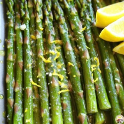 - Fresh asparagus: 1 pound - Olive oil: 3 tablespoons - Garlic: 4 cloves, minced - Lemon zest: from 1 lemon - Fresh lemon juice: 2 tablespoons - Red pepper flakes: 1 teaspoon (optional) - Salt and pepper: to taste - Parmesan cheese: 2 tablespoons, freshly grated (optional) - Lemon wedges: for serving When you gather your ingredients, focus on freshness. Look for bright green asparagus. You want firm stalks with tight tips. The olive oil should be high quality, as it adds great flavor. Fresh garlic packs a punch, enhancing the dish. I love using fresh lemon zest. It brightens the flavors and gives zestiness. The juice adds that tangy kick, making each bite refreshing. If you like a bit of heat, consider the red pepper flakes. They are optional but add a nice touch. Salt and pepper are key to balancing flavors. You may add Parmesan cheese for richness. It melts beautifully over warm asparagus. Finally, serve with lemon wedges. They offer a fresh squeeze when you are ready to eat. For the full recipe, check out the details above. - Step 1: Preheat the oven to 425°F (220°C). This high heat helps the asparagus roast well. - Step 2: Prepare asparagus and combine with olive oil. Trim the woody ends off the asparagus. In a large bowl, add 1 pound of asparagus and 3 tablespoons of olive oil. Toss until each spear is coated. - Step 3: Add remaining ingredients and toss. Next, add 4 cloves of minced garlic, the zest of 1 lemon, 2 tablespoons of fresh lemon juice, and 1 teaspoon of red pepper flakes if you want some heat. Season with salt and pepper. Toss everything together until well mixed. - Step 4: Arrange asparagus on a baking sheet. Spread the seasoned asparagus in a single layer on the baking sheet. This helps them cook evenly. - Step 5: Roast asparagus for 12-15 minutes. Place the baking sheet in the preheated oven. Roast until the asparagus is tender and slightly crispy at the tips. - Step 6: Sprinkle with Parmesan cheese (if using). After removing the asparagus from the oven, add 2 tablespoons of freshly grated Parmesan cheese on top if you like. Serve warm with lemon wedges on the side for extra flavor. For the complete recipe, check out the [Full Recipe]. To make your lemon garlic asparagus shine, use high-quality olive oil. This oil adds depth and richness. It also helps the garlic and lemon flavors pop. You can also experiment with different herbs. Try adding fresh thyme or rosemary for a new twist. These herbs bring a lovely aroma and taste. When roasting, avoid overcrowding the baking sheet. If the asparagus spears touch, they steam instead of roast. This makes them soft, not crisp. Adjust the roasting time based on asparagus thickness. Thicker spears need a bit more time. Keep an eye on them to ensure they turn out just right. Pair your lemon garlic asparagus with grilled meats. It complements chicken, fish, or steak perfectly. You can also serve it alongside a fresh salad. This adds a light and crisp touch to your meal. For the full recipe, check the details above. {{image_2}} To give your Lemon Garlic Asparagus new flavors, try these options. - Lemon Herb Variation: Add thyme or rosemary for a fresh taste. - Spicy Kick: Increase red pepper flakes or add chili powder for heat. These simple changes can elevate your dish and cater to different palates. You can also change how you cook your asparagus. - Sautéing on the stovetop: This method gives a quick cook. Just heat olive oil in a pan and add the seasoned asparagus. Cook for about 5-7 minutes. - Grilling for smoky flavor: Grill asparagus for about 8-10 minutes. The char adds depth and a wonderful taste. Both methods keep the asparagus crisp while adding unique flavors. Make this dish fit the season. - Spring: Add in seasonal vegetables like peas or radishes. They add color and flavor. - Summer: Serve it chilled as a salad. Just let the roasted asparagus cool, then toss with a light dressing. These variations keep your meals fresh and exciting all year round. For the full recipe, check out the recipe section above! Store any leftovers in an airtight container. This keeps the asparagus fresh. It is best eaten within 2-3 days. After that, the flavor and texture may change. To reheat, use the oven or a skillet. This method keeps the texture nice and crisp. Avoid using the microwave because it can make the asparagus soggy. If you want to freeze asparagus, start by blanching it. Blanching means boiling it briefly, then cooling it in ice water. This keeps the bright color and flavor. You can store frozen asparagus for up to 3 months. After that, it may lose its taste and texture. To trim asparagus, hold a spear in each hand. Bend the asparagus until it snaps. This break will remove the tough, woody end. You can also cut off about an inch from the bottom with a knife. This method helps keep the tender part of the asparagus. Yes, you can prepare Lemon Garlic Asparagus ahead of time. Wash and trim the asparagus, then mix with olive oil and spices. Store it in the fridge for up to two days. When you're ready to cook, just roast it in the oven. This saves time on busy days and keeps it fresh. Asparagus is done when it turns bright green and is tender. You can poke it with a fork to check. The tips should be slightly crispy, while the stalks remain firm. If it feels soft and mushy, it may be overcooked. A perfect cook keeps the asparagus bright and vibrant. You now know how to make delicious lemon garlic asparagus. I covered the ingredients, cooking steps, and helpful tips. Remember, you can switch things up with flavors and cooking methods. Keep your leftovers fresh and tasty with proper storage. This dish is easy to enjoy any time. So, gather your ingredients and try it out. You might just find a new favorite!