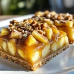 To make caramel apple shortbread bars, you need: - 2 cups all-purpose flour - 1/2 cup powdered sugar - 1 cup unsalted butter, softened - 1/4 teaspoon salt - 3 medium apples, peeled and diced - 1 teaspoon cinnamon - 1 tablespoon lemon juice - 1 cup caramel sauce - 1/2 cup rolled oats - 1/4 cup chopped walnuts (optional) - 1/2 teaspoon vanilla extract These ingredients create a sweet and tart dessert that you will love. I find that Granny Smith apples are the best choice. Their tartness balances the sweet caramel. Honeycrisp apples also work well for a sweeter flavor. Use your favorite variety for a personal touch. You can swap unsalted butter for coconut oil for a dairy-free option. Use brown sugar instead of powdered sugar for a richer taste. If you want a nut-free version, skip the walnuts or replace them with sunflower seeds. For gluten-free bars, use a gluten-free flour blend. Start by preheating your oven to 350°F (175°C). Use a 9x13-inch baking pan. Grease it or line it with parchment paper. This helps with easy removal later. In a large bowl, cream 1 cup of softened butter and 1/2 cup of powdered sugar. Mix until it’s light and fluffy. Gradually add 2 cups of all-purpose flour and 1/4 teaspoon of salt. Keep mixing until a dough forms. Now, press about two-thirds of the dough into the bottom of your pan. Make sure it’s even and compact. This part is your shortbread crust, so don’t skip this step! In a separate bowl, take 3 medium apples, peel and dice them. I recommend Granny Smith apples for their tartness. Toss them with 1 tablespoon of lemon juice and 1 teaspoon of cinnamon. This adds a nice zing to your apples. Spread the apple mixture evenly over the crust. Next, drizzle half of your caramel sauce (1 cup total) over these apples. Spread it evenly to ensure each bite has caramel goodness. Now, sprinkle the remaining dough over the apples. This will create a nice topping. If you like, add 1/2 cup of rolled oats and 1/4 cup of chopped walnuts for a nice crunch. Finally, drizzle the rest of the caramel sauce on top. Place your pan in the preheated oven. Bake for 35 to 40 minutes. You want the top to be golden brown and bubbly. Once baked, remove the pan from the oven. Let it cool completely in the pan before slicing. This cooling time helps the bars set up nicely. For the perfect shortbread, use cold butter. Cut it into small cubes before mixing. Cream the butter and sugar until light. This step is key. Mix the flour and salt gently. Don’t overmix; keep it crumbly. Press two-thirds of the dough into the pan firmly. This creates a strong base. Wait until the bars cool completely. This helps them set well. Use a sharp knife to cut them into squares. Wipe the knife between cuts for clean edges. Serve them on a nice platter. Drizzle extra caramel on top for a sweet touch. Garnish with a sprinkle of cinnamon for flair. For more flavor, add a pinch of nutmeg with the cinnamon. You can also mix in a dash of vanilla extract into the apple layer. If you like nuts, chopped walnuts add a nice crunch. Try using different apples for unique tastes. Honeycrisp apples bring sweetness, while Granny Smith adds tartness. {{image_2}} You can make these bars even better in the fall. Adding pumpkin gives a rich flavor. Just mix 1 cup of pure pumpkin puree into the apple mixture. This adds moisture and nice color. It also pairs well with the spices. For a gluten-free version, swap all-purpose flour for a gluten-free blend. Look for one that works well in baking. You may need to adjust the liquid a bit. Check the package for tips. This way, everyone can enjoy these tasty bars. If you want to change the nuts, try pecans or almonds. Both add great flavor and crunch. Chopped nuts give extra texture in every bite. You can even leave them out if you prefer a nut-free treat. To keep your Caramel Apple Shortbread Bars fresh, store them in an airtight container. This helps to lock in the moisture and prevent them from drying out. Line the container with parchment paper for easy removal. Keep the bars at room temperature for a day or two. If you need to store them for longer, refrigerate them. Freezing these bars is simple and great for meal prep. First, let the bars cool completely. Then, slice them into squares. Wrap each square in plastic wrap tightly. Place the wrapped bars in a freezer-safe bag or container. Label it with the date. You can freeze the bars for up to three months. When stored properly, Caramel Apple Shortbread Bars last about a week at room temperature. In the fridge, they can last up to two weeks. When you want to eat a frozen bar, take it out and let it thaw in the fridge overnight. If you prefer them warm, place them in the oven at 350°F for about 10 minutes. Enjoy the gooey caramel and tender apples! Yes, you can use different caramel sauces. Store-bought works well, and homemade adds a special touch. I love using salted caramel for a sweet and salty mix. You can even try chocolate caramel if you want a rich twist. Just make sure it’s thick enough to hold its shape when layered. To make homemade caramel sauce, you need sugar, butter, and cream. Here’s a simple way: - In a saucepan, heat one cup of sugar over medium heat. - Stir it until it melts and turns golden brown. - Add half a cup of butter and stir until melted. - Slowly pour in half a cup of heavy cream while stirring. - Cook for another 2-3 minutes until smooth. Let it cool before using. This sauce adds a great flavor to your bars. You can serve these bars with many tasty options. Here are some ideas: - A scoop of vanilla ice cream for a creamy contrast. - Whipped cream to add a light and fluffy touch. - Fresh apple slices for some crunch. - Drizzle more caramel sauce on top for extra sweetness. These pairings enhance the flavor and make your dessert even more fun! This blog post covered all you need to know about making Caramel Apple Shortbread Bars. We explored the best ingredients, from apple types to smart substitutions. You learned step-by-step how to prepare the crust, layer the ingredients, and bake. Plus, I shared tips for perfecting the texture and storing your bars. Don't forget to try variations like adding pumpkin or making them gluten-free. With these insights, you’ll create delightful treats every time. Enjoy your baking adventure!